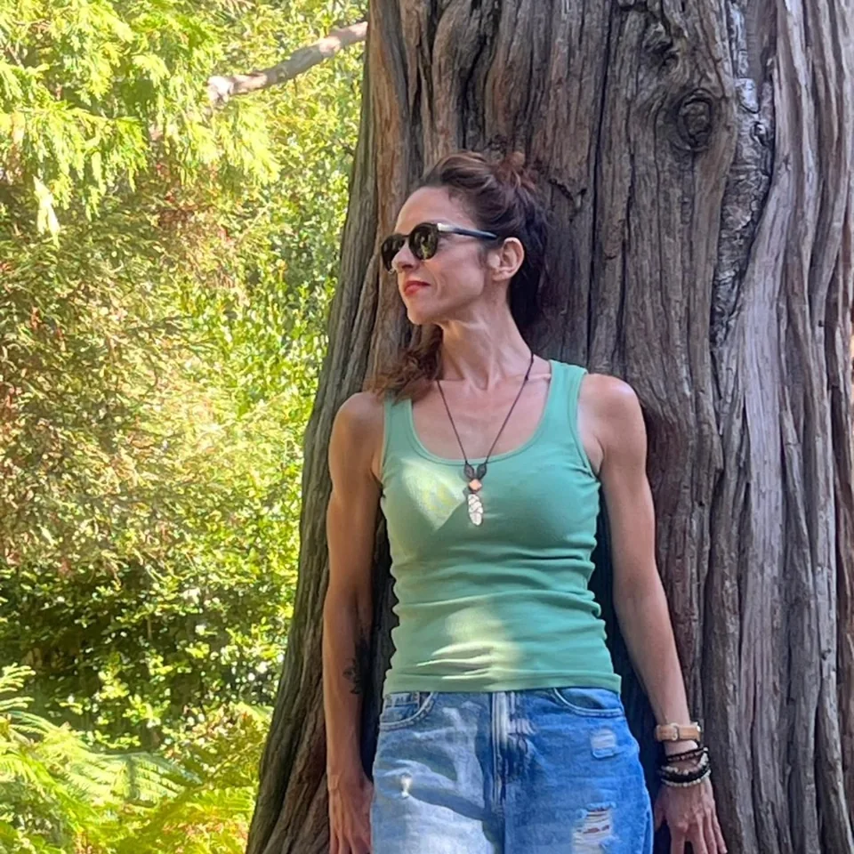 Vedrana beside a tree